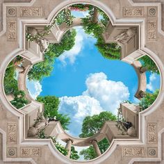 an artistic view of the sky and trees from inside a circular window with columns on either side