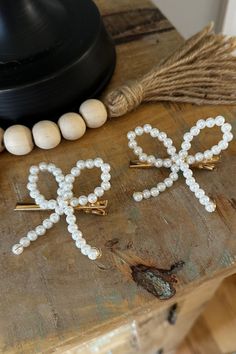 Instantly upgrade your hairstyle with our Set of Pearl Bow Clips! Each set includes 2 beautiful hair clips adorned with lustrous pearls. Achieve a chic and elegant look for any occasion with these versatile accessories. Bejeweled Hair, Bow With Pearls, Lily Calloway, Crochet Bow, Hair Bow Clip, Crochet Bows, Pearl Bow, Hair Ribbons, Bow Clip