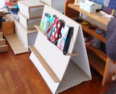 there are many boxes stacked on top of each other in this room, and the floor is hard wood