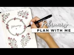 a person writing on a notebook with the words, february plan with me