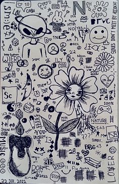 a piece of paper with drawings on it and writing all over the place, including an image of a flower