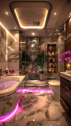 a bathroom with a tub, sink, and toilet in the middle of it is lit up by purple lights