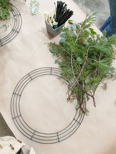 the table is covered with plants and wire