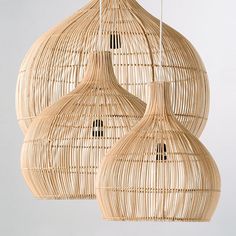 two wicker lamps hanging from the ceiling