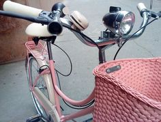 a close up of a bicycle with a basket on the front