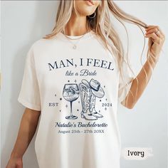 a woman wearing a t - shirt that says man, i feel like a bride