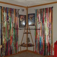 there is a room that has many ribbons on the wall and in front of it