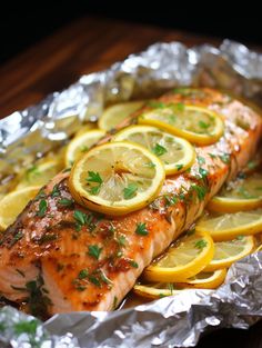 salmon with lemon slices and parsley on foil