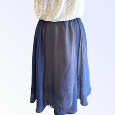 Best Seller - Tie Waist Overskirt in Indigo silk chiffon. Skirt is very versatile and can be worn over a slip, leggings, bathing suit, etc., or wear it as a slip. Pair it with one of our tops for a seamless dressed up look. Now available in Ivory, Indigo, Cloud Blue, Pistachio and Vintage Rose. One Size fits most. - princess seams - drawstring ties To prevent shrinkage, hand wash in cold water, hang to dry, or dry cleaning is recommended. Please email for additional information and before placin Fitted Skirt With Elastic Waistband For Daywear, Stretch Gathered Skirt For Daywear, Elegant Ruffled Skirt For Daywear, Chic Flowy Knee-length Bottoms, Flowy Lined Maxi Skirt For Daywear, Flowy Daywear Skirt With Elastic Waistband, Flowy Skirt With Elastic Waistband For Daywear, Elegant Ruffled Daywear Skirt, Elegant Blue Skirt With Elastic Waistband