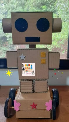 a cardboard robot made to look like it's sitting on top of a table