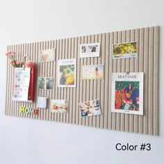 a bulletin board with pictures and magnets attached to it's sides, hanging on the wall