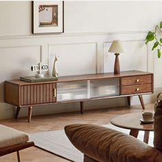 a living room scene with focus on the coffee table and sideboard in the background