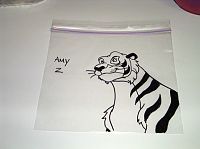 a drawing of a tiger sitting on top of a table