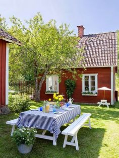 an instagram page with a picnic table in front of a red house