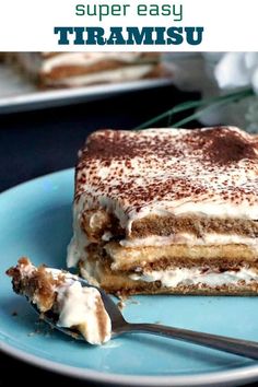 a piece of tirami cake on a blue plate with a fork next to it