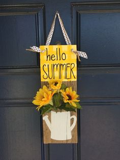 a door hanger with sunflowers and a sign that says hello summer