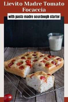 two slices of pizza sitting on top of a cooling rack next to a glass of milk