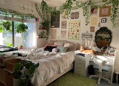 a bed room with a neatly made bed and lots of plants on the wall above it