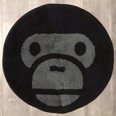 a round rug with a monkey face on it