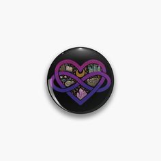 a purple and black button with an image of a heart in the center, on a white background