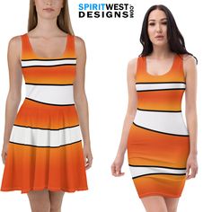 a woman in an orange and white dress with black stripes on it, standing next to another model