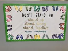 a sign that says, don't stand by and stands up to stand together