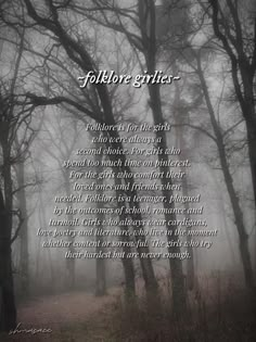 a poem written in black and white on a foggy forest path with trees behind it