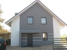 a car is parked in front of a house