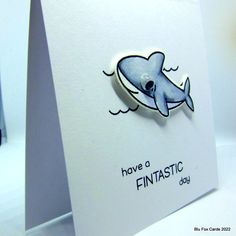 a card with a shark on it and the words have a fantastic day written below