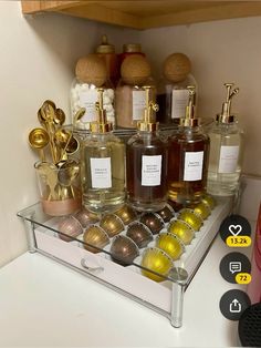 a shelf filled with lots of different types of perfumes on top of a counter