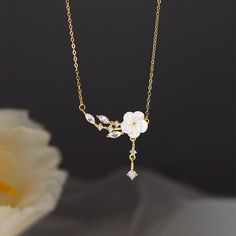 An elegant Cherry Blossom pendant delicately hung on a golden silver chain. Crafted with custom pearls, the Cherry Blossom pendant exudes unique charm. Perfect gift idea A perfect pick for any outfit Cherry Blossom Jewelry, Cherry Blossom Necklace, Teardrop Necklace, Plum Blossom, Unique Charms, Ring Bracelet, Iphone Phone Cases, Cherry Blossom, Beautiful Jewelry