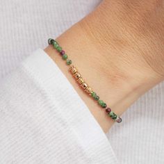 Embrace the beauty of vibrant semi-precious gemstones with our Green Gemstone Bracelet, perfect for adding a pop of color to your vacation jewelry collection. Pair with our Green Gemstone Necklace for a matching look.&nbsp;18K Champagne Gold PlatedChain length: 7, adjustable to 6.2Gemstone Rubis Zoisite: 0.1Sent with love in a complimentary gift box Green Gemstone Bracelet, Green Gemstone Necklace, Vacation Jewelry, Grandmother Gifts, Engraved Bracelet, Crystal Stars, Holiday Jewelry, Green Gemstones, Drop Necklace