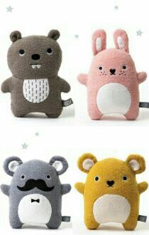 four small stuffed animals are shown in different colors