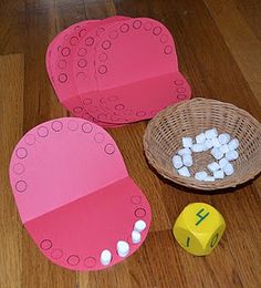 Roll that dice to add the "teeth."  "For the circle marks, I stamped a marker lid in some black ink."  Is it ironic  or what, to use marshmallows on a tooth decay lesson?  Mama Bee From the Hive Blog- great pictures & activities. (modify to fit subtraction)