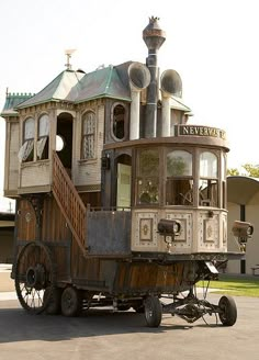 an old train cart is parked in front of a building