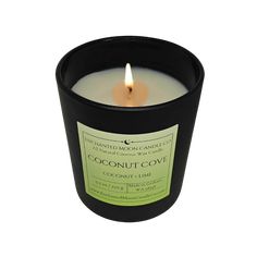 a candle that is sitting on top of a white surface with the words coconut cove written in