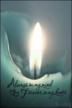 a lit candle with the words always on my mind and forever in my heart written below it