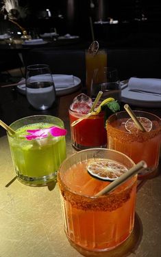 three different types of drinks on a table