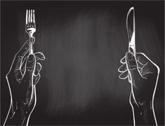 two hands holding silverware in front of a chalkboard background