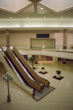 an escalator in the middle of a large building