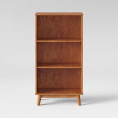 a wooden bookcase with three shelves