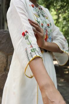 White dress with multi colored resham embroidery in duck and floral motifs. Comes with plain chanderi pant.
Components: 2
Pattern: Embroidered
Type Of Work: Floral and Duck
Neckline: Notched
Sleeve Type: Bell
Fabric: Handwoven Chanderi
Color: White
Other Details: 
Gathered details
Tassel on yoke
Side panels
Occasion: Work - Aza Fashions Applique Kurta, Resham Embroidery, Applique Work, Casual Indian Fashion, Suits Design, Kurta Designs Women, Embroidery Suits Design, Embroidery Designs Fashion, Dress Indian Style