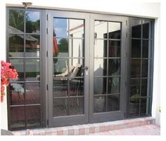 an image of a patio with sliding glass doors on the front door and side windows