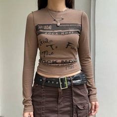 SIZE Length/cm Bust/cm Waist/cm Bottom Width/cm Shoulder/cm Sleeve/cm S 47 75 64 / 33 62 M 48 89 68 / 34 63 L 49 83 72 / 35 64 NOTE: 1. Please strictly follow the size chart to select the size. Do not select directly according to your habits.2. Still not sure about size? We'd love to advise based on your measurements of bust, waist and hip.3.The size may have 2-3cm differs due to manual measurement. Please note when you measure. Fall Baddie, Top Aesthetic, Tøp Aesthetic, Baby Tees Y2k, The Fallout, Bodysuit Dress, Fall Tee, Aesthetic Shirts, Long Sleeve Tops Casual