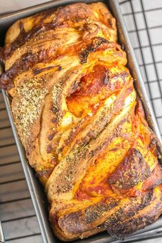 a loaf of bread sitting on top of a cooling rack