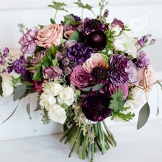 a bouquet of flowers sitting on top of a table