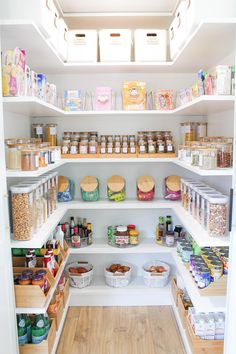 an organized pantry with lots of food and containers on the shelves, including cereals