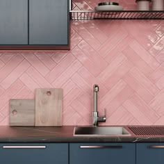 a kitchen with pink and blue cabinets, stainless steel sink and wooden cutting board on the counter