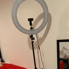 a camera is set up in front of a mirror to record the light being used