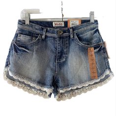 These Adorable Mudd Scalloped Lace Trim High Rise Shorts Are Perfect For Wherever Your Warm Weather Days Take You. Ideal Pair Of Shorts For Beach Wear. Sits High At The Waist. Comes From A Smoke/Pet Free Home. Questions Are Welcomed, Please Ask Before Buying. To Ensure The Proper Fit, Please Refer To The Measurements Provided. Features 28" Waist 10" Long . High Rise Denim Blue Five (5) Pockets Flat Front 67% Cotton, 32% Polyester 1% Spandex Zip/Button Fastening Waist Thank You For Looking!!! Cute Denim Bottoms For Summer, Cute Summer Denim Bottoms, Stretch Denim Shorts For Beach, Cute Denim Blue Short-length Bottoms, Cute Short Length Denim Bottoms, Cute Short Summer Jeans, Vacation Denim Bottoms In Medium Wash, Medium Wash Denim Vacation Bottoms, Denim Jean Shorts With Frayed Hem For Vacation